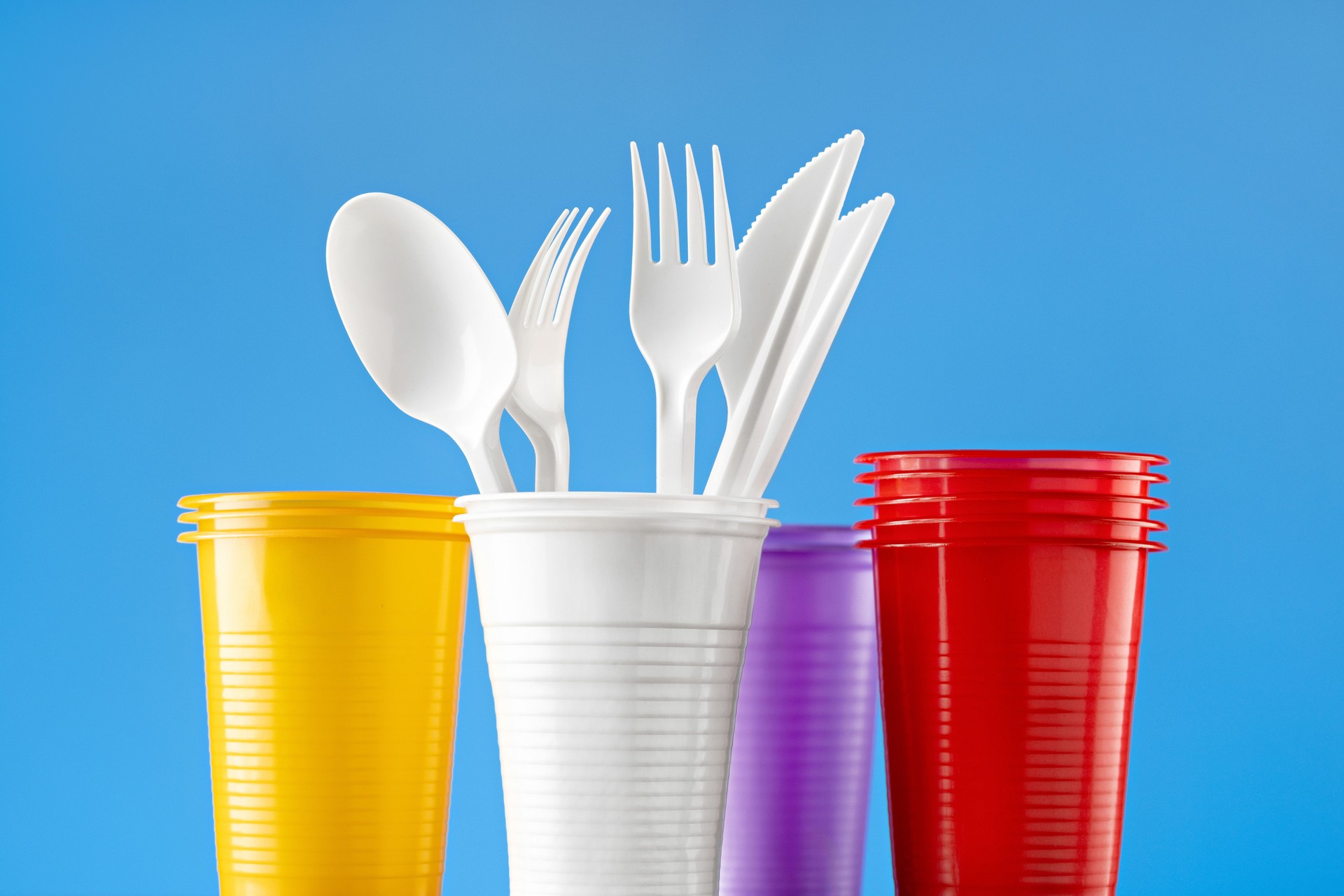 Disposable colored plastic tableware.